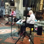 A rare shot of Zoot Money and Al Kirtley both concentrating on their playing. St. Peter's Church, Bournemouth 21 June 2019.