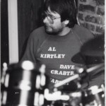 Mick Kirby at one of our early jazz gigs. Spot the then name of the band on his tee-shirt.